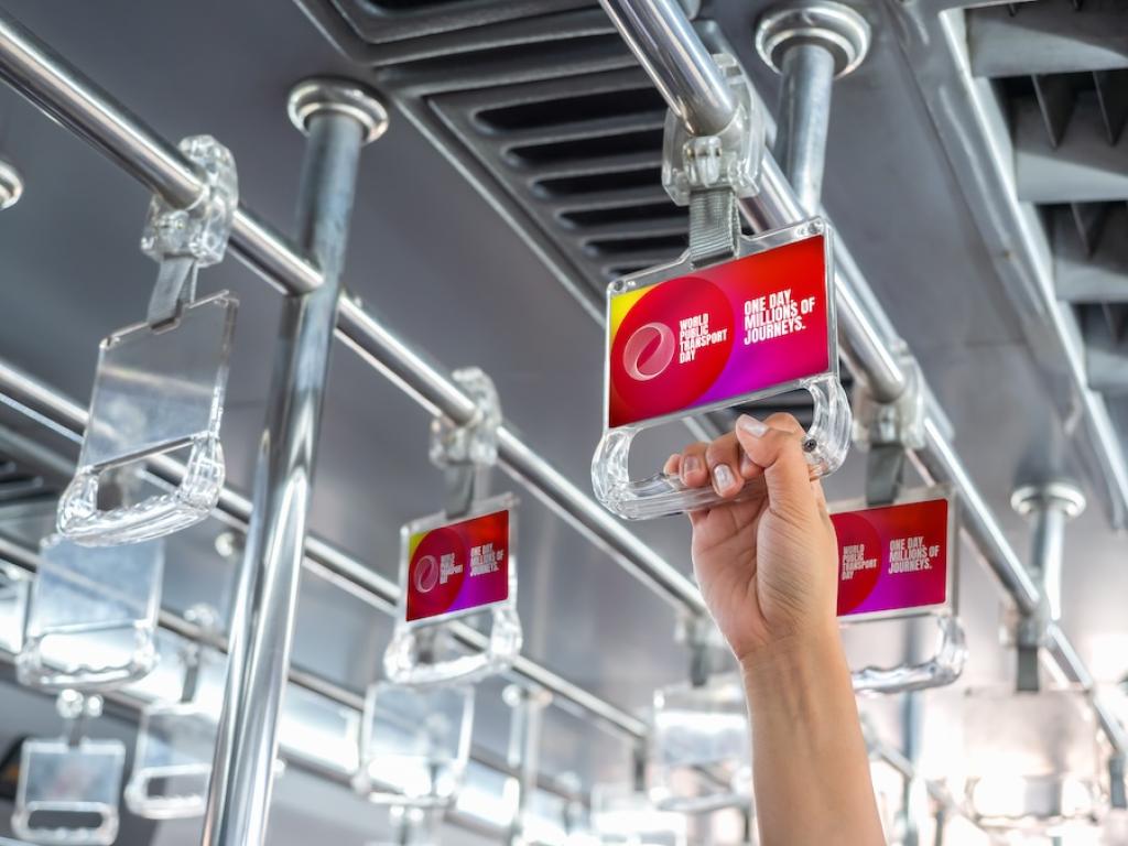 Branded handgrips used on buses and rail transport