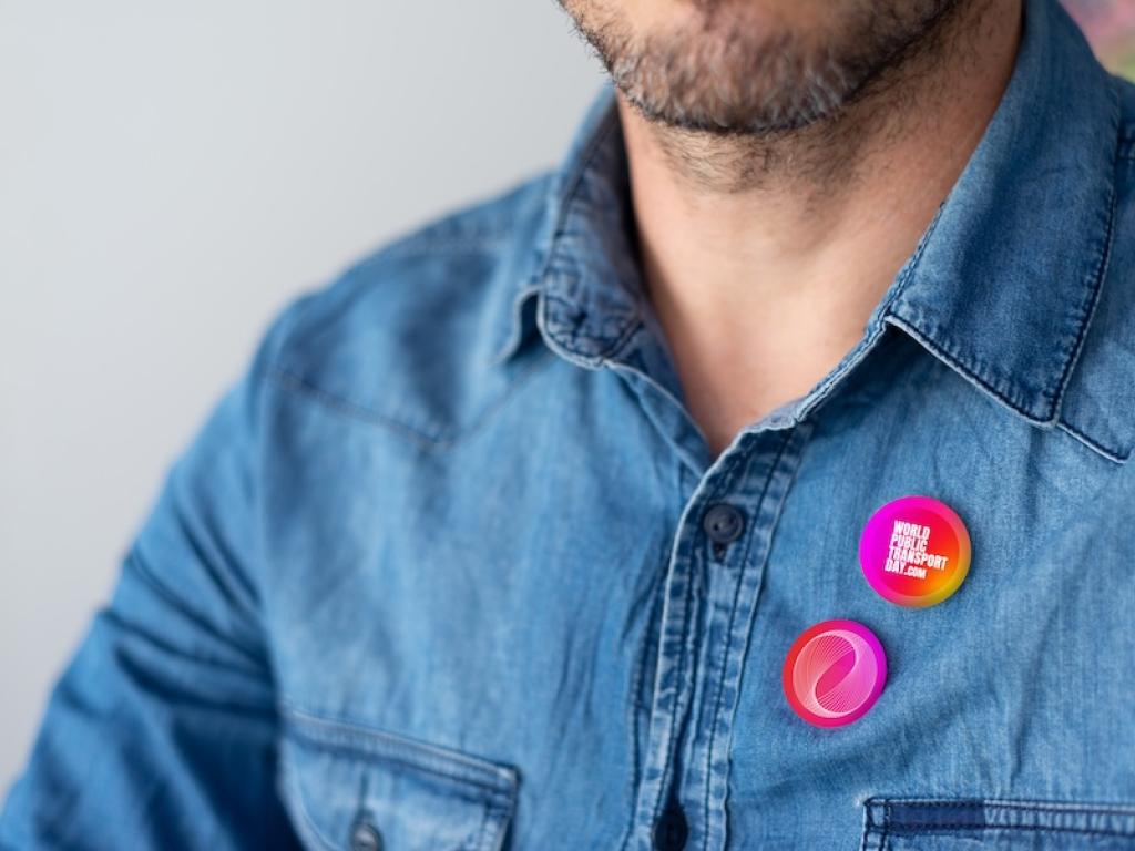 examples of badges pinned to a shirt