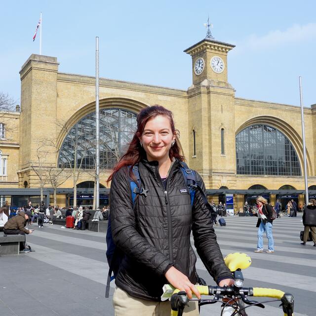 A picture of Jules outside a train station