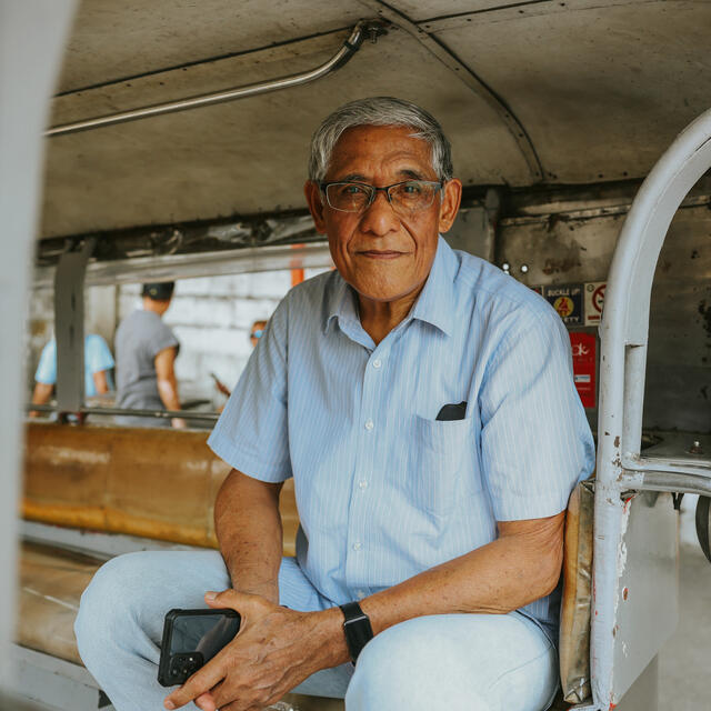 A picture of Mario Basilio sat in a transport vehicle 